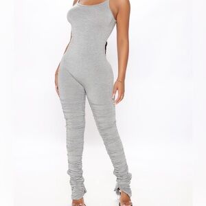 Never worn. Gray jumpsuit.